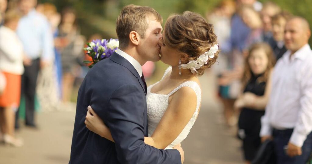 This is a traditional photo idea of the wedding first kiss